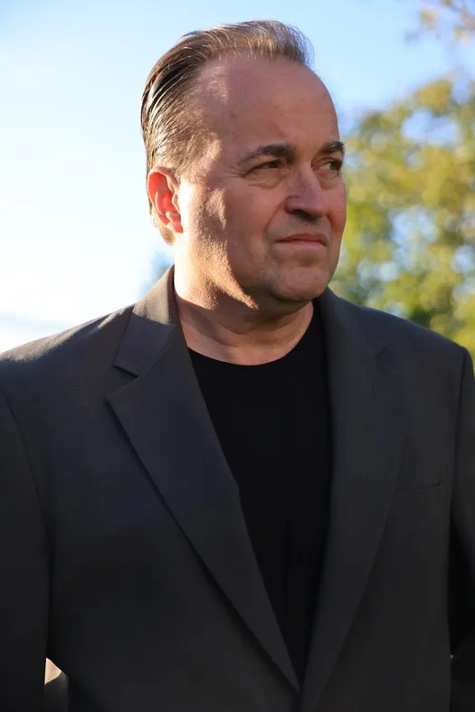 Author Steven S. Thomas smiling outdoors